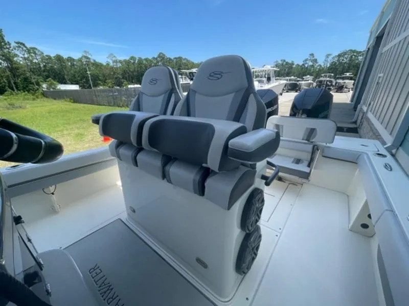 Slide: The Image of 2020 ShearWater 270 Carolina Flare boat interior with dual seats and clean deck. - 15