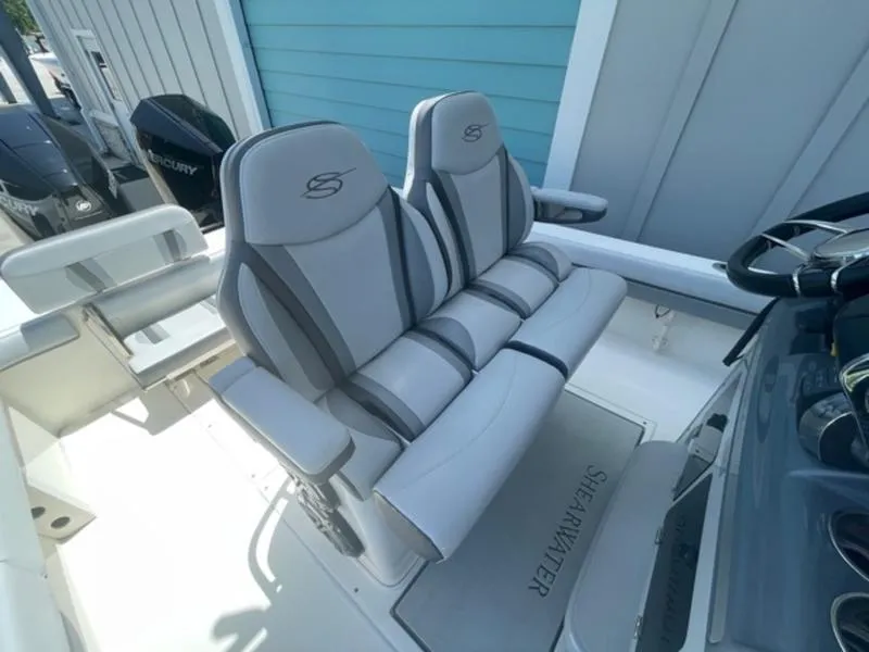 Slide: The Image of 2020 ShearWater 270 Carolina Flare boat with dual captain's chairs and Mercury engine. - 16