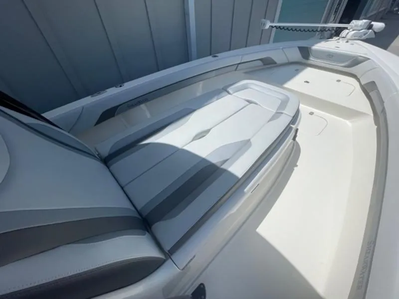 Slide: The Image of 2020 ShearWater 270 Carolina Flare boat interior with cushioned seating. - 25