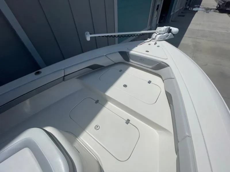 Slide: The Image of 2020 ShearWater 270 Carolina Flare boat deck with storage compartments and trolling motor. - 27