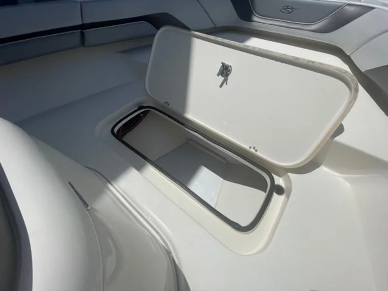 Slide: The Image of Open storage compartment on a 2020 ShearWater 270 Carolina Flare boat. - 29