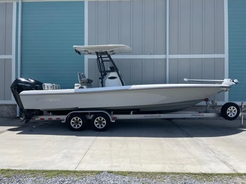 Slide: The Image of 2020 ShearWater 270 Carolina Flare boat on a trailer, side view. - 3