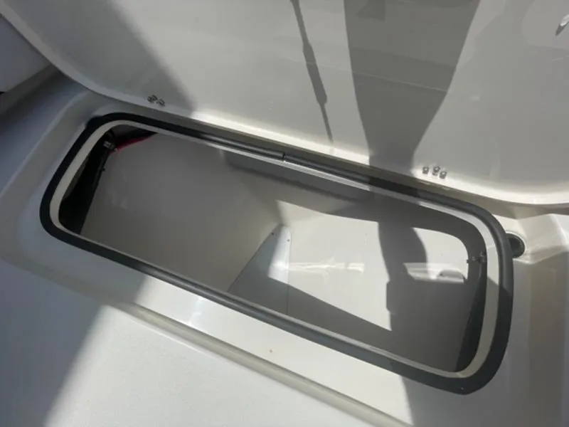 Slide: The Image of Open storage compartment on a 2020 ShearWater 270 Carolina Flare boat. - 30