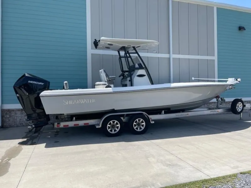 Slide: The Image of 2020 ShearWater 270 Carolina Flare boat on a trailer, side view. - 4
