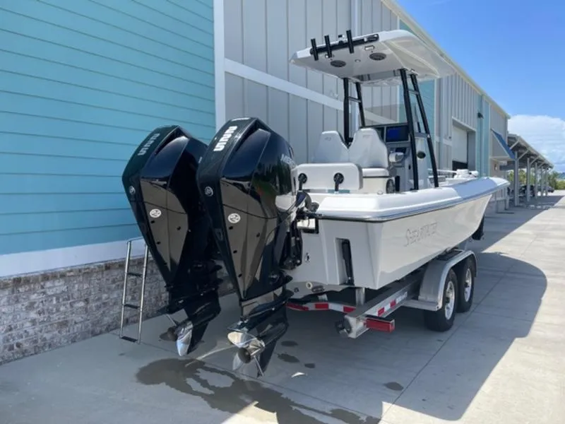 Slide: The Image of 2020 ShearWater 270 Carolina Flare boat with twin engines on trailer. - 5