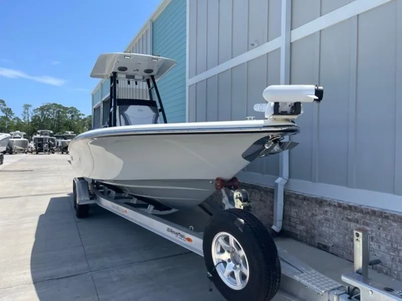 Slide: The Image of 2020 ShearWater 270 Carolina Flare boat on a trailer, docked outdoors. - 8