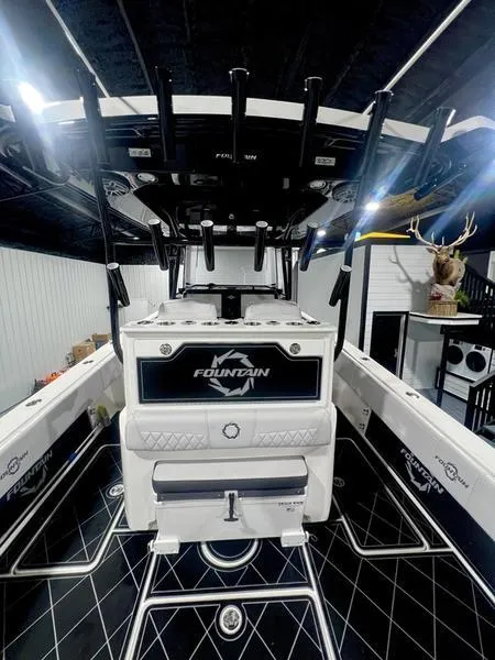 Slide: The Image of 2022 Fountain 34 TE boat interior with advanced fishing setup and modern design. - 13