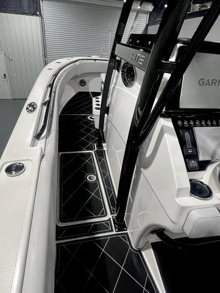 Slide: The Image of 2022 Fountain 34 TE boat interior with black and white diamond-patterned flooring. - 15