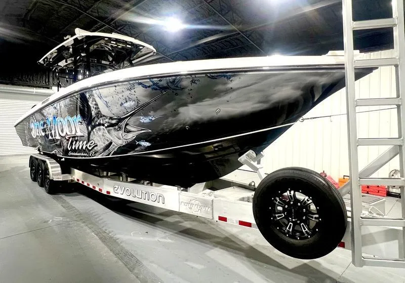 Slide: The Image of 2022 Fountain 34 TE boat on Evolution trailer in indoor storage. - 3