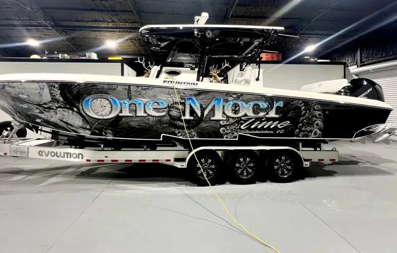 Slide: The Image of 2022 Fountain 34 TE boat on trailer in indoor storage. - 4
