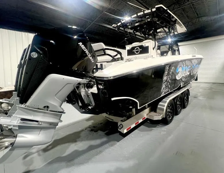Slide: The Image of 2022 Fountain 34 TE boat with Mercury outboard engines on a trailer. - 6