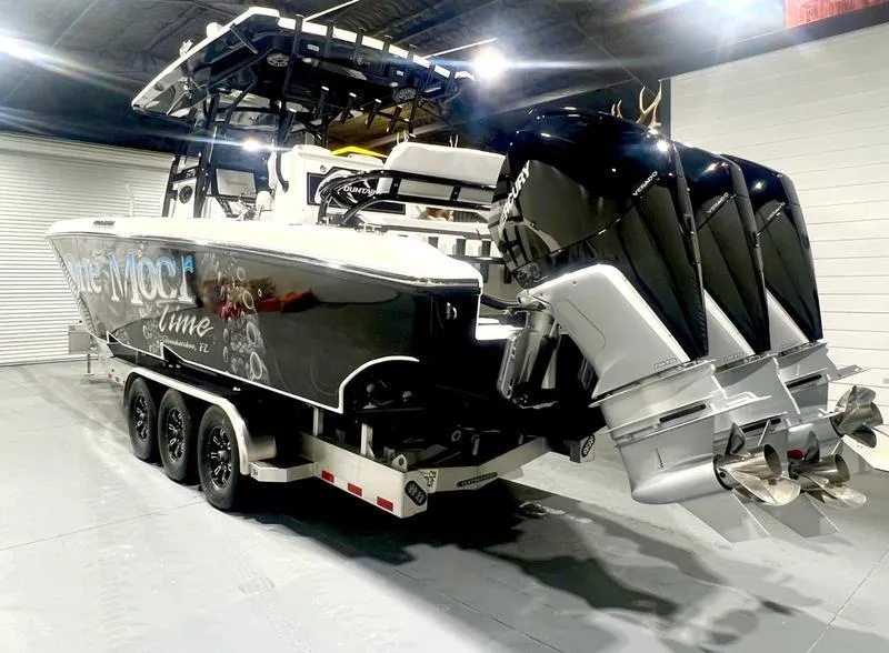 Slide: The Image of 2022 Fountain 34 TE boat on a trailer in a garage. - 7