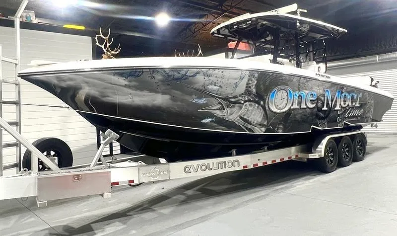 Slide: The Image of 2022 Fountain 34 TE boat on Evolution trailer in indoor storage. - 9