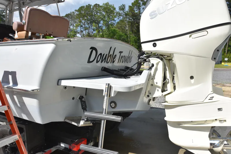 Slide: The Image of Custom Carolina 28 Cape Lookout boat, 2007 model, with 2019 repower, featuring Suzuki outboard. - 10