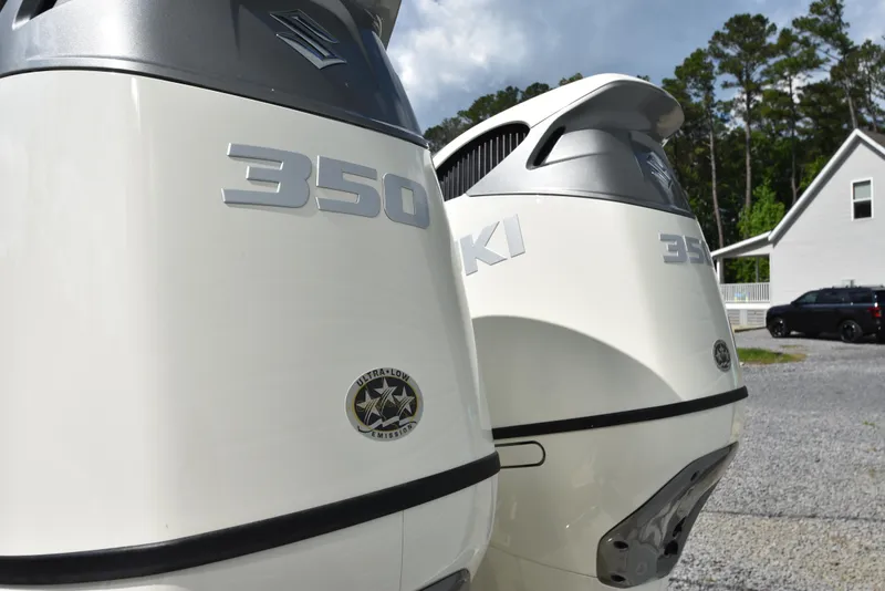 Slide: The Image of Outboard engines on a 2007 Custom Carolina 28 Cape Lookout, repowered in 2019. - 11
