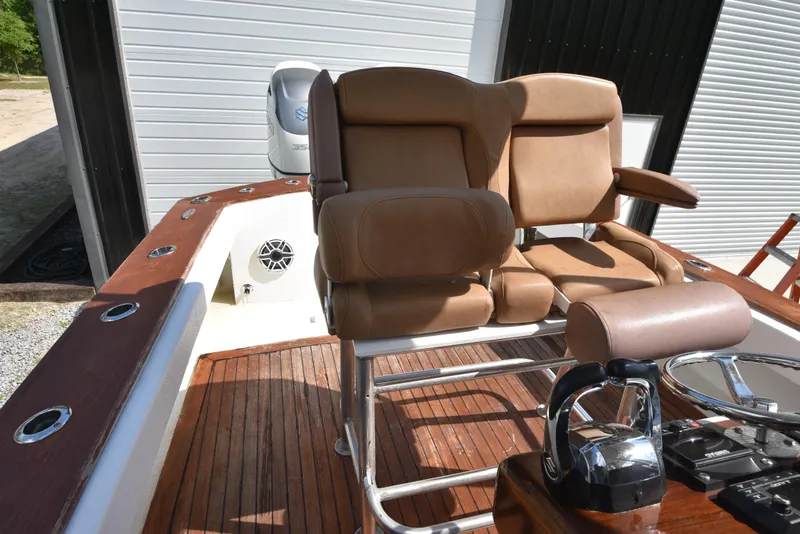 Slide: The Image of Custom Carolina 28 Cape Lookout boat interior with leather seating and wooden deck, 2007 model. - 26