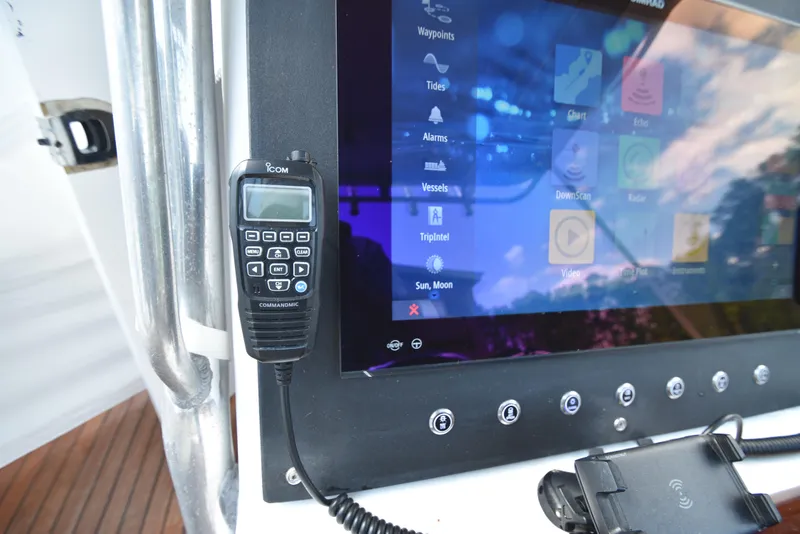 Slide: The Image of Boat dashboard with Icom radio and touchscreen display on Custom Carolina 28 Cape Lookout, 2007 model. - 31