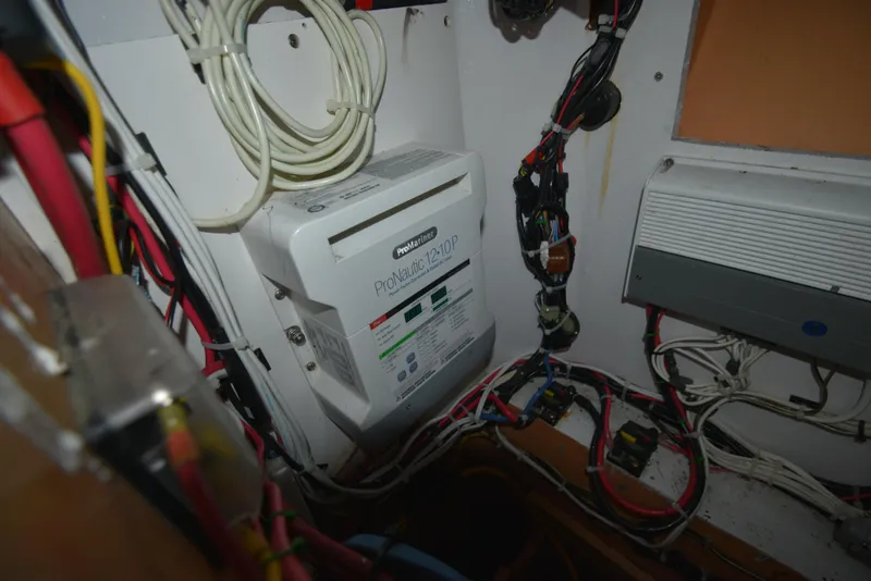 Slide: The Image of Electrical wiring and ProNautic charger inside a 2007 Custom Carolina 28 Cape Lookout boat. - 43