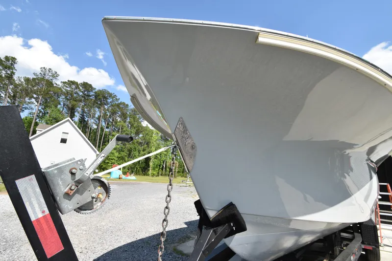 Slide: The Image of Custom Carolina 28 Cape Lookout boat on trailer, 2007 model, repowered in 2019, outdoors. - 5