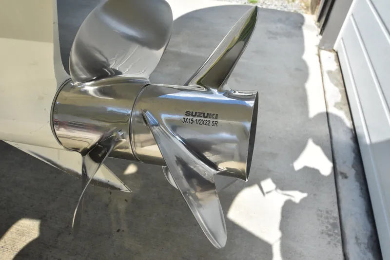 Slide: The Image of Shiny Suzuki propeller on a Custom Carolina 28 Cape Lookout boat, 2007 model. - 8
