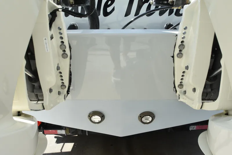 Slide: The Image of Rear view of a 2007 Custom Carolina 28 Cape Lookout boat, showcasing repowered engines. - 9