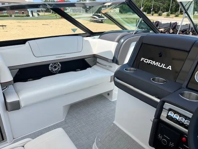 Slide: The Image of Interior of 2025 Formula 330 Crossover Bowrider I/O, featuring luxurious seating and modern dashboard. - 10