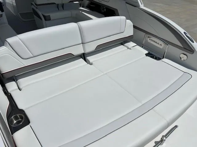 Slide: The Image of 2025 Formula 330 Crossover Bowrider I/O with luxurious white seating. - 4