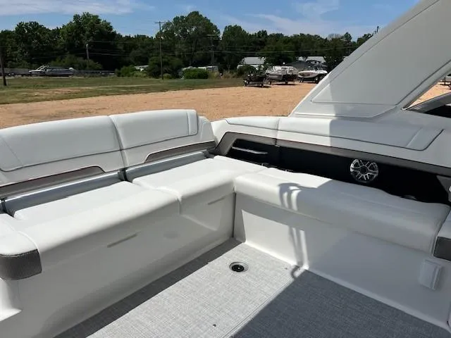 Slide: The Image of 2025 Formula 330 Crossover Bowrider I/O interior seating area with white upholstery. - 5