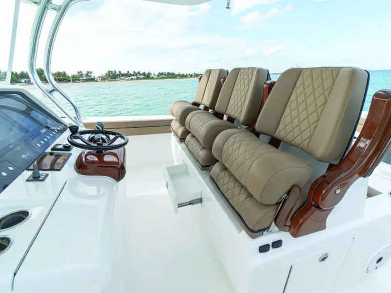 Slide: The Image of 2025 Valhalla Boatworks V-41 helm seating with luxurious tan upholstery. - 16