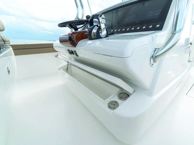 Slide: The Image of 2025 Valhalla Boatworks V-41 helm station with modern controls and storage. - 18