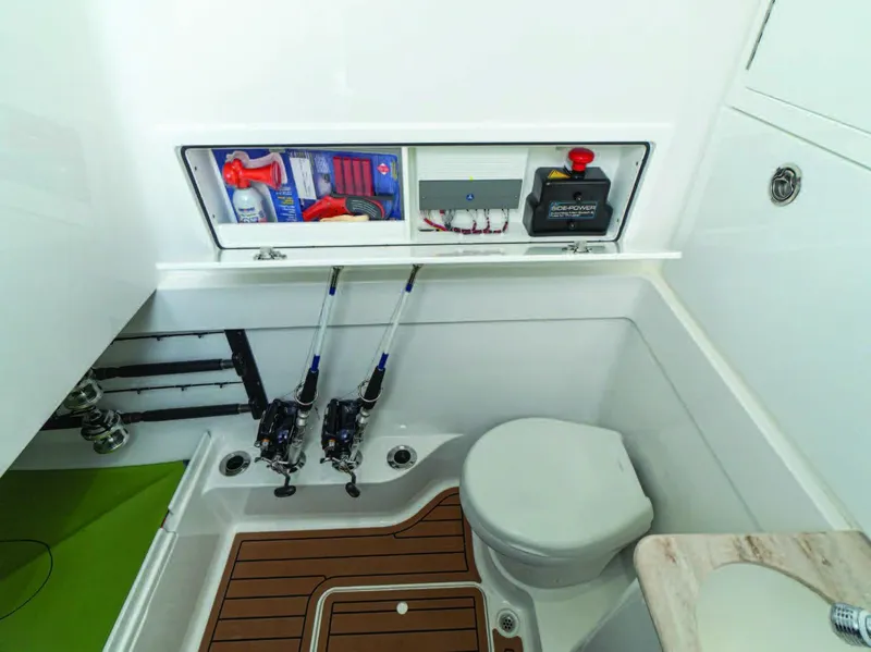 Slide: The Image of 2025 Valhalla Boatworks V-41 interior with fishing gear storage and marine toilet. - 25