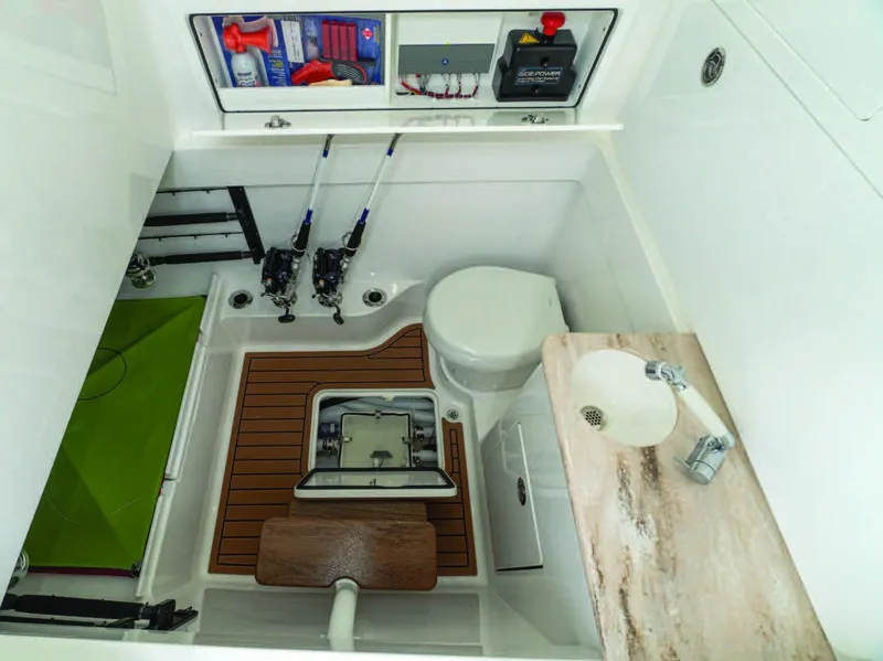 Slide: The Image of Valhalla Boatworks V-41 2025 model interior with fishing gear, toilet, and sink. - 26