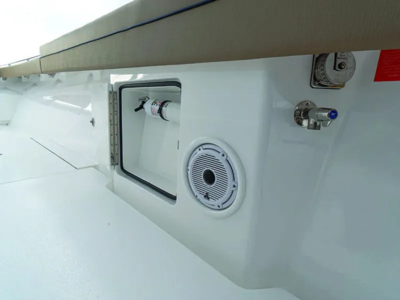 Slide: The Image of Valhalla Boatworks V-41 2025 model interior, featuring storage compartment and speaker. - 30