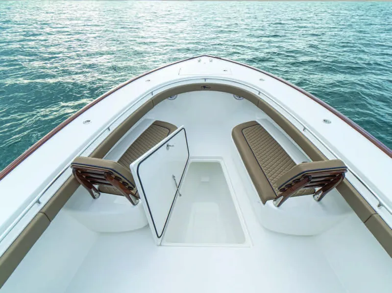Slide: The Image of 2025 Valhalla Boatworks V-41 bow seating area with storage compartment. - 32
