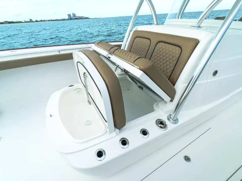 Slide: The Image of 2025 Valhalla Boatworks V-41 with open storage compartment and cushioned seating. - 33