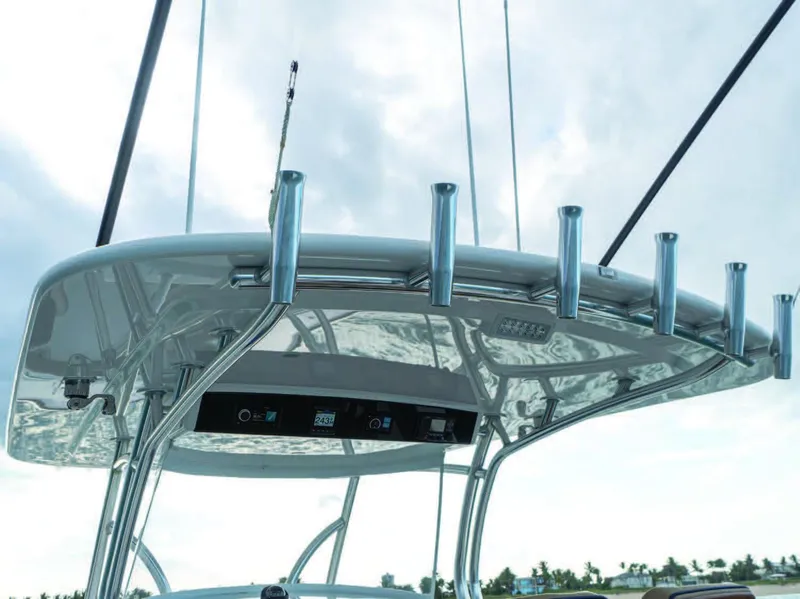 Slide: The Image of 2025 Valhalla Boatworks V-41 T-top with rod holders and electronic controls. - 35