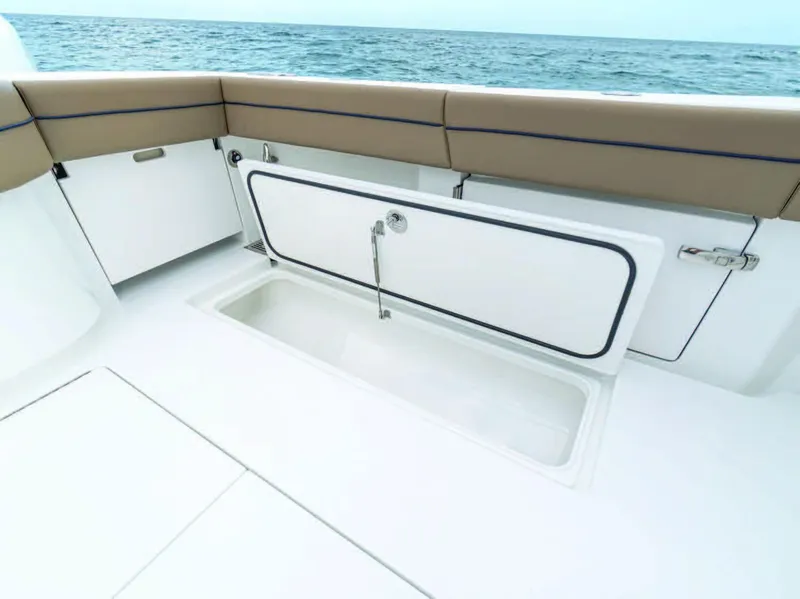 Slide: The Image of 2025 Valhalla Boatworks V-41, open storage compartment on deck, ocean in background. - 5