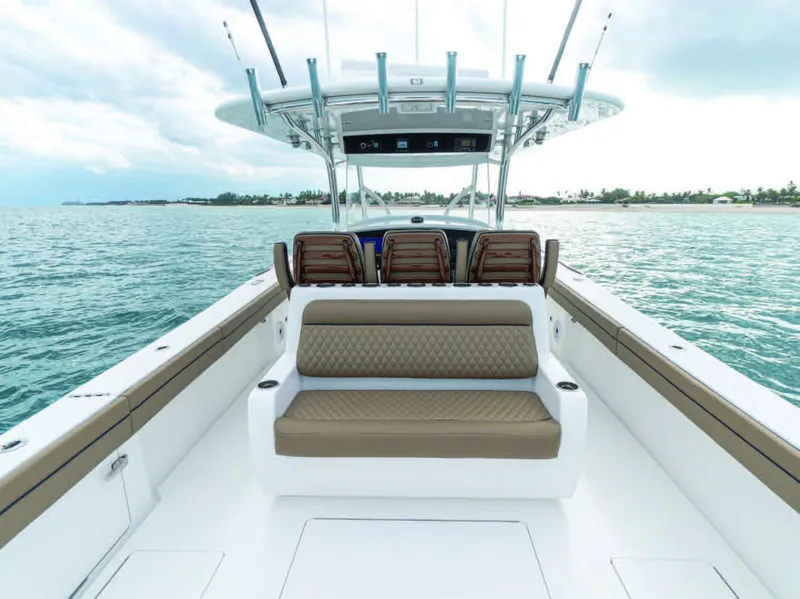 Slide: The Image of 2025 Valhalla Boatworks V-41 center console boat with cushioned seating on open water. - 9