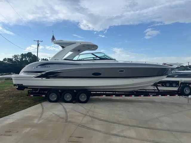 Slide: The Image of 2025 Formula 350 Crossover Bowrider I/O on a trailer, side view. - 1