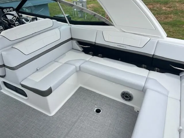 Slide: The Image of 2025 Formula 350 Crossover Bowrider I/O interior with white and gray seating. - 10