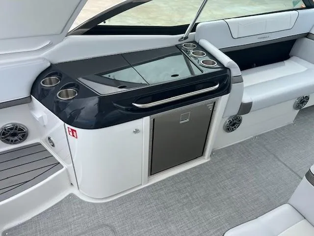 Slide: The Image of 2025 Formula 350 Crossover Bowrider I/O interior with sleek seating and modern amenities. - 11