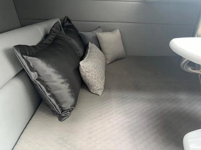 Slide: The Image of Interior cabin of 2025 Formula 350 Crossover Bowrider I/O with plush pillows. - 16