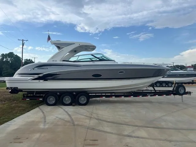 Slide: The Image of 2025 Formula 350 Crossover Bowrider I/O on a trailer, side view. - 2