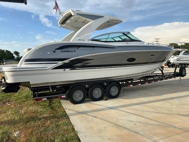 Slide: The Image of 2025 Formula 350 Crossover Bowrider I/O on a trailer, side view. - 3