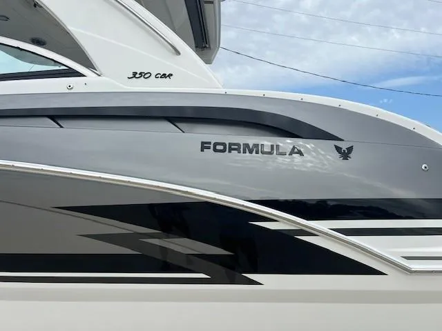 Slide: The Image of 2025 Formula 350 Crossover Bowrider I/O side view with sleek design and logo. - 5