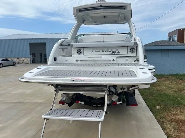 Slide: The Image of 2025 Formula 350 Crossover Bowrider I/O, rear view with extended swim platform. - 6