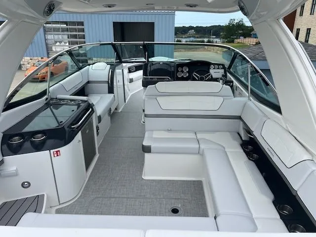 Slide: The Image of 2025 Formula 350 Crossover Bowrider I/O interior with white seating and modern dashboard. - 9