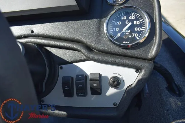 Slide: The Image of 2024 Ranger RT178 boat dashboard with RPM gauge and control switches. - 10