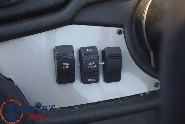 Slide: The Image of Control panel of a 2024 Ranger RT178 boat with bilge pump and aerator switches. - 11