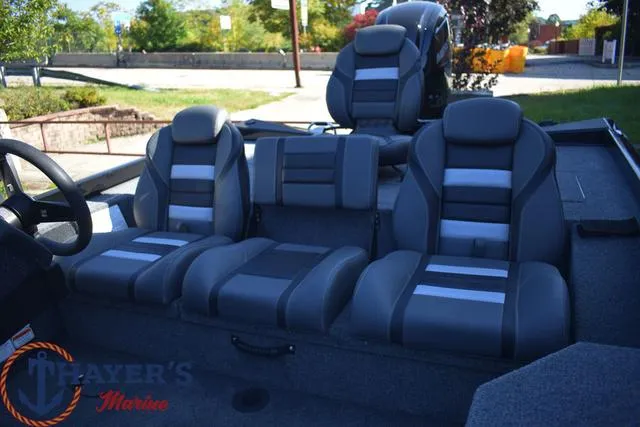 Slide: The Image of 2024 Ranger RT178 boat interior with gray and black seating, Thayer's Marine logo. - 12